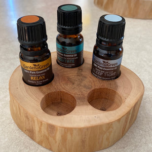 3 of our oils (Relax, Meditate and Sleep tight are sitting in our 5 Hole Sugar Maple Essential Oil Stand crafted from sturdy, beautiful sugar maple to create a stylish and elegant way to store your essential oils. sitting on a table