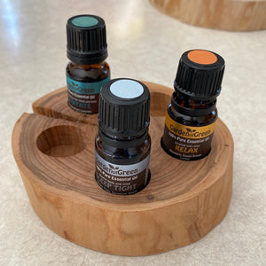 Our 5 Hole Sugar Maple Essential Oil Stand is crafted from sturdy, beautiful sugar maple to create a stylish and elegant way to store your essential oils. The five holes hold your most treasured oils, providing a secure place to store them and display them with pride. Enjoy the natural beauty of this unique essential oil stand.