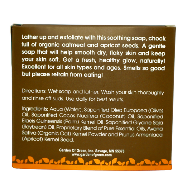 Garden of Green's oatmeal apricot bar soap back view in dark brown box with orange leaf foil on the bottom of box. the background it white