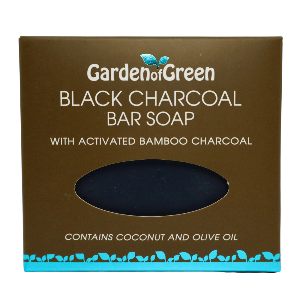 Garden of Green black charcoal bar soap front view in a dark brown box with a light blue foil with leaves on the bottom of the box. the background is white