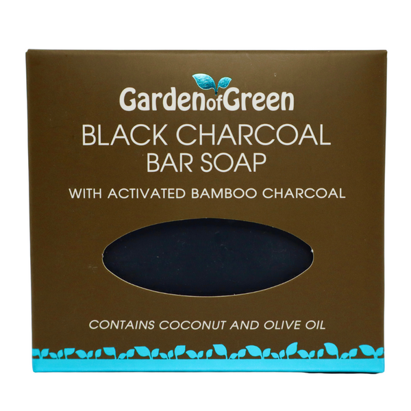 Garden of Green black charcoal bar soap front view in a dark brown box with a light blue foil with leaves on the bottom of the box. the background is white
