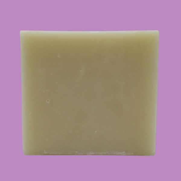 Lavender fields bar soap standing up right showing a square. all on a light purple background