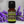 Luxury lavender essential oil in glass bottle, family-crafted aromatherapy product with eco-conscious packaging, front view with lavender flowers in the background