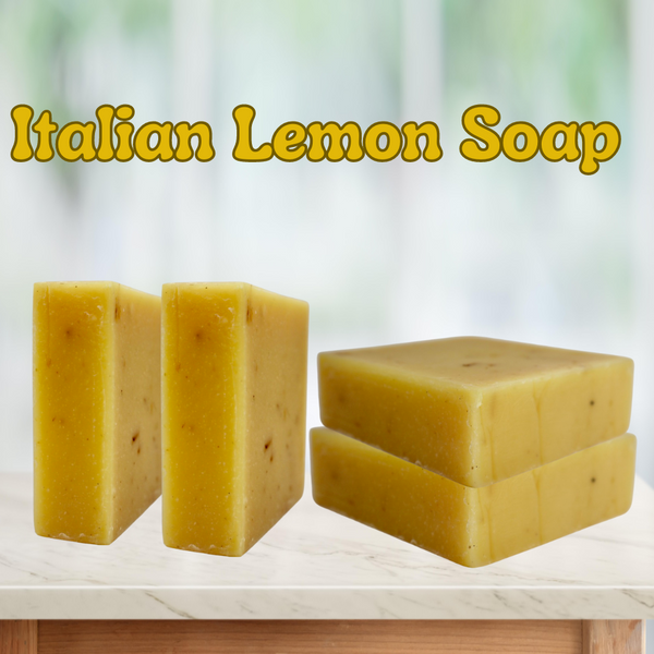 "Italian Lemon Soap" is the title of the picture all in yellow. 4 plain bars of soap are sitting on a white table in different ways, 2 of them are stacked and two are sitting up right. all on a white background that fades to a light green