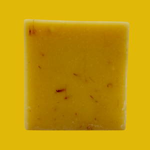 Italian Lemon Bar Soap plain standing up like a a square on a yellow background
