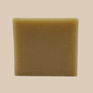Pachouli bar soap standing up right like a square with a tan background