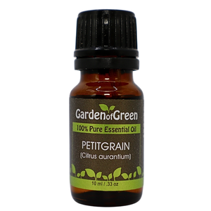 Petitgrain essential oil in amber glass bottle, family-crafted aromatherapy oil, front view on white background