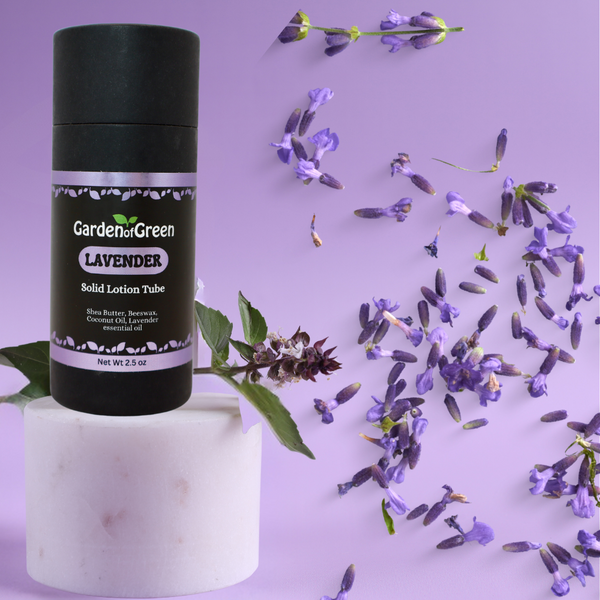 Garden of Green's Lavender solid lotion tube front view sitting on a white stand with lavender sprinkled all around on a lavender background