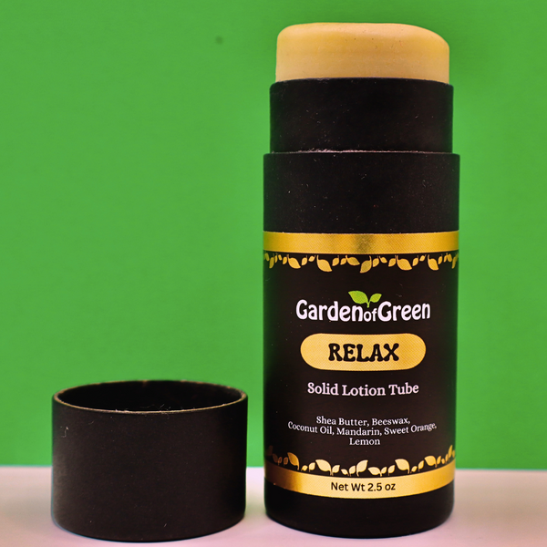 Garden of Green's Relax solid lotion tube front view sitting on a white table and a green background