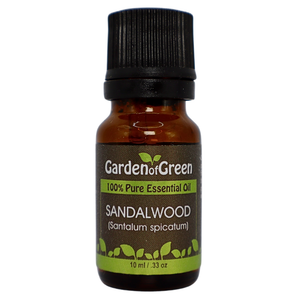 Sandalwood essential oil in amber glass bottle, family-crafted aromatherapy oil, front view on white background