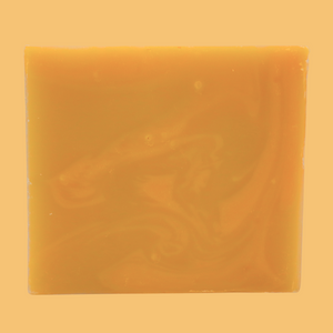 vanilla orange bar soap with a yellowish tan background 