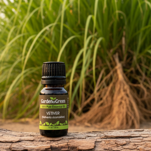 Vetiver essential oil, family-crafted aromatherapy oil, front vetiver grass in the background with the oil sitting on a log